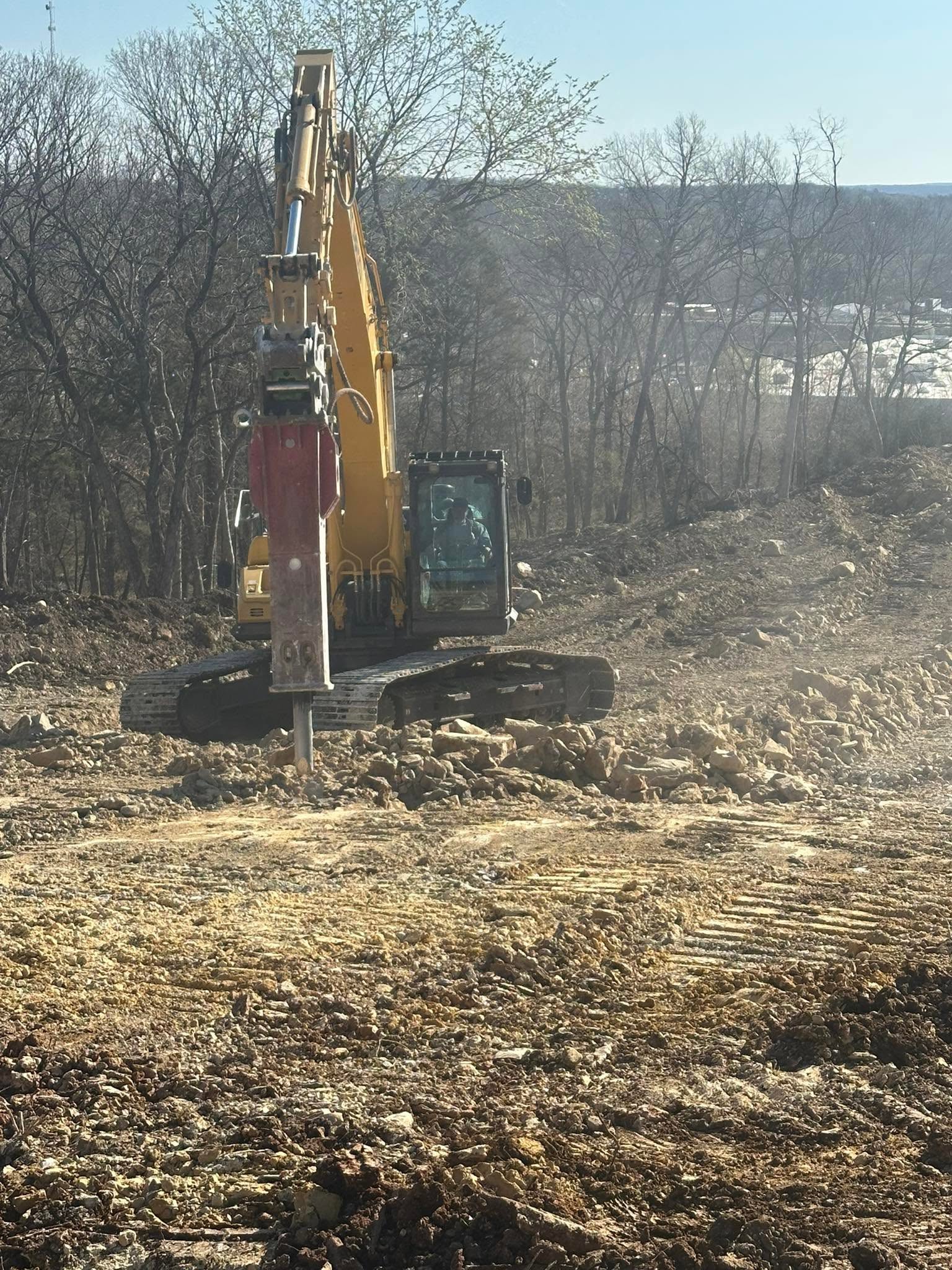 Drainage grading and dirt work on a rural Henry County job site