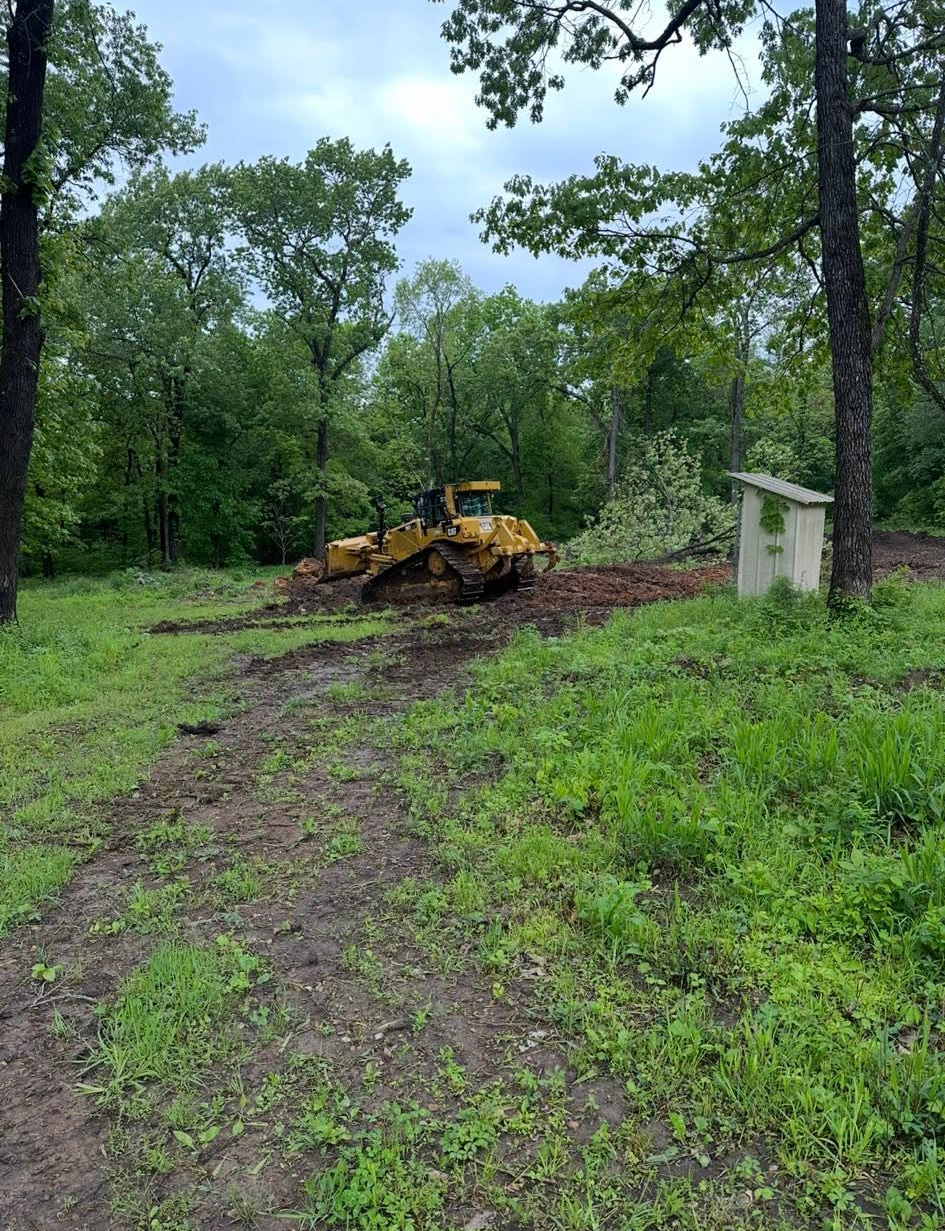 Excavation contractor shaping drainage ditches in Windsor, MO
