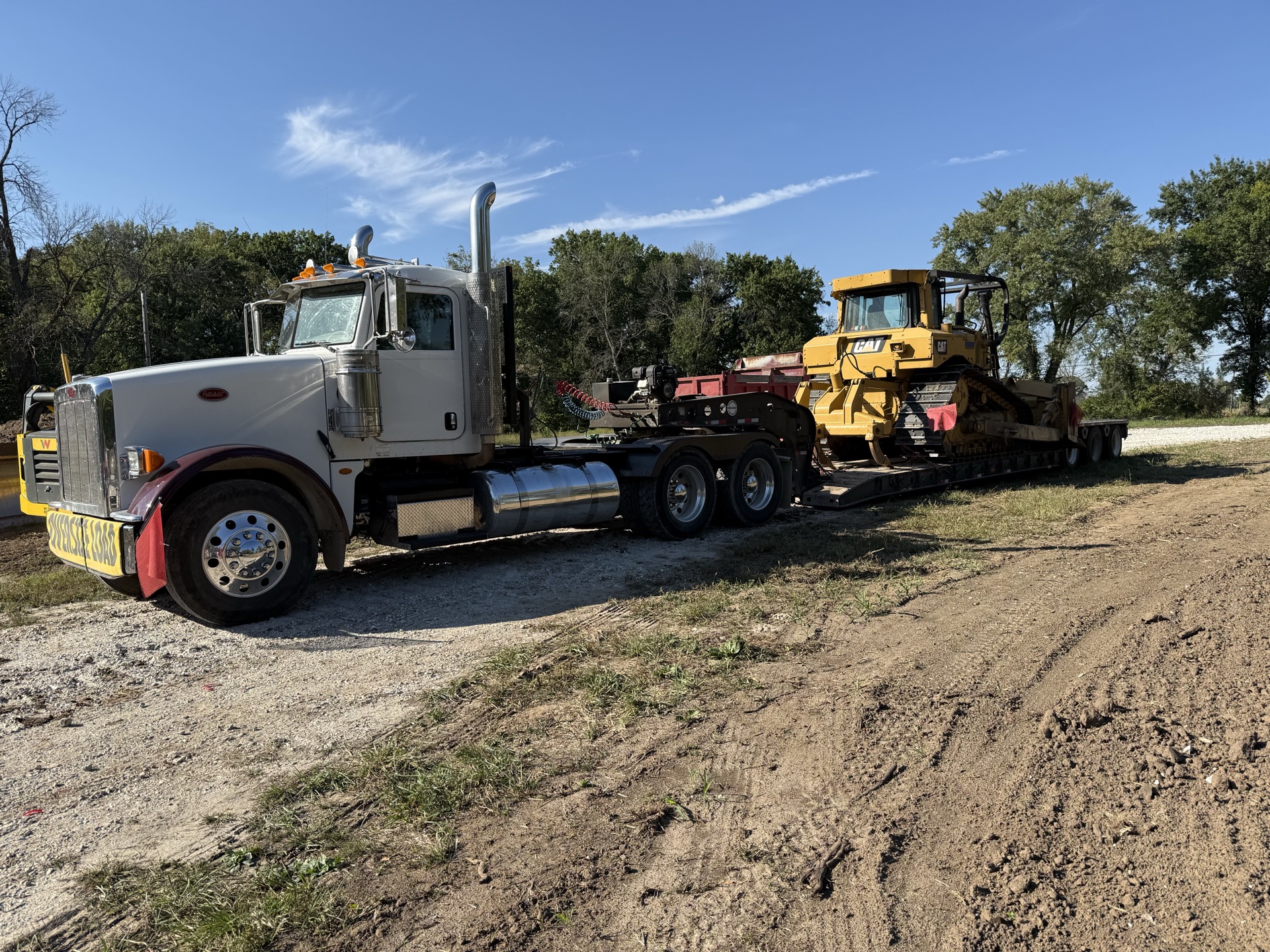 Peterbilt hauling a CAT bulldozer to a Henry County excavation job