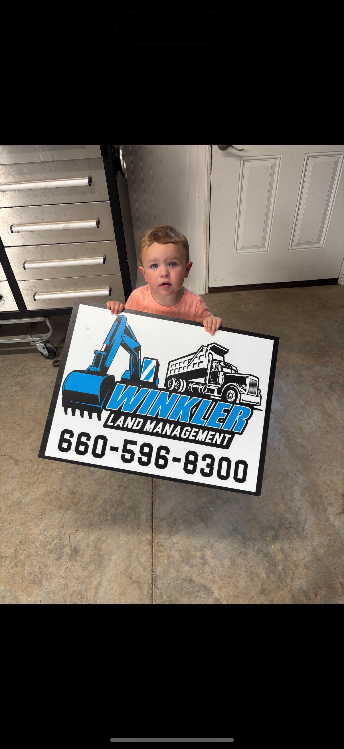 Winkler Land Management job-site sign with company phone number