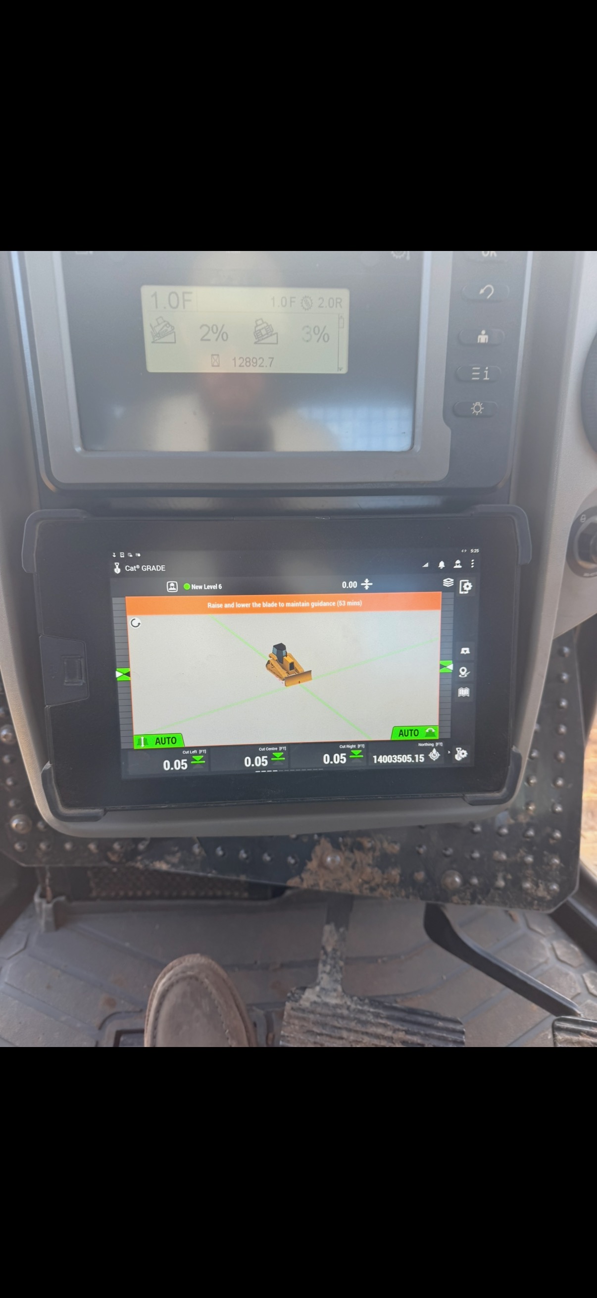GPS grade-control screens guiding precision dirt work in Henry County