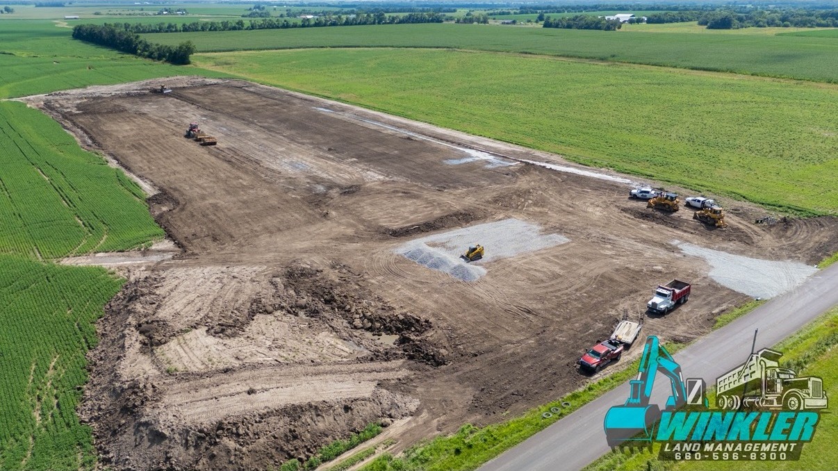 Aerial view of large graded pad and earthwork in Henry County, MO